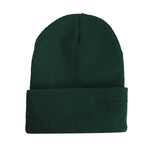 Close-up of the dark green knit texture and folded cuff on this warm beanie hat