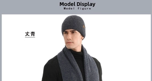 Detail of navy blue ribbed knit beanie and scarf set featuring a brown leather patch