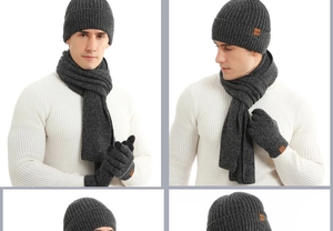Close-up of dark grey thick knit beanie, scarf and gloves with stylish leather labels