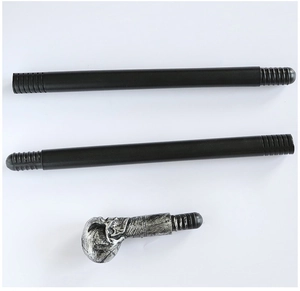 Detail of detachable skull head scepter with silver metallic handle and black threaded rods