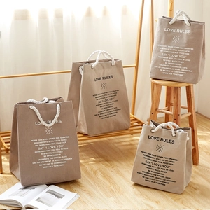 Large beige cotton canvas storage bag with rope handles and Love Rules printed quote