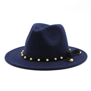 Detailed view of dark blue wool fedora hat featuring faux pearls and ribbon bow decoration