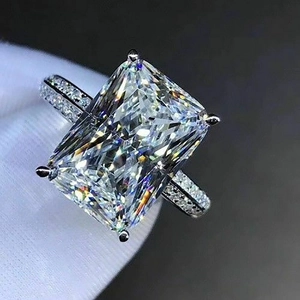 Classic silver ring featuring a large radiant cut zircon with a pave diamond band