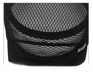 Detail of breathable honeycomb mesh and reinforced stitching on a black flat top cap