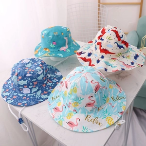 Detail of four colorful printed sun hats for kids with adjustable chin straps