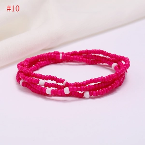 Detail of multi-layer handmade colorful beaded waist chain with pink and white resin beads