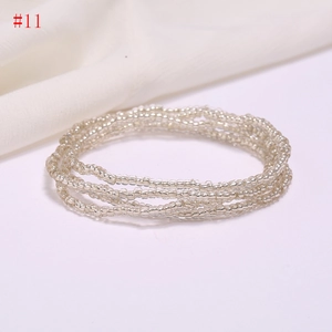 Close-up of multi-layer silver beaded waist chain with shimmering glass seed beads