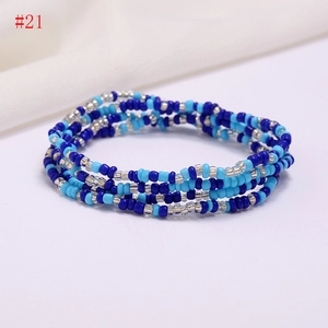 Detail of multi-layer colorful seed beads waist chain with blue and silver hues