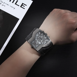 Mens quartz watch with large dual movement dial and black leather strap on wrist