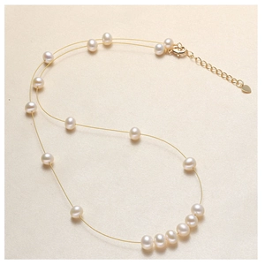 Minimalist freshwater white pearl necklace on fine gold chain with heart pendant