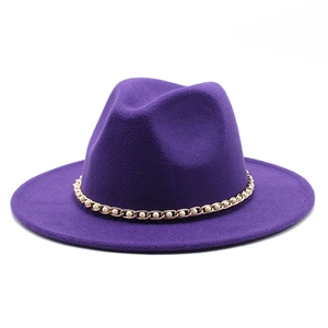 Close-up of deep purple wool felt jazz hat featuring a decorative gold pearl chain link