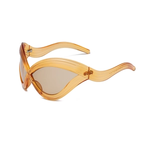 Futuristic wave-textured amber oversized cat eye sunglasses with brown lenses