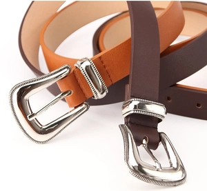 Detail view of retro bohemian buckles with sunburst texture on PU leather belts