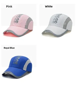 Detailed view of quick-dry baseball caps in pink, white, and blue with mesh panels