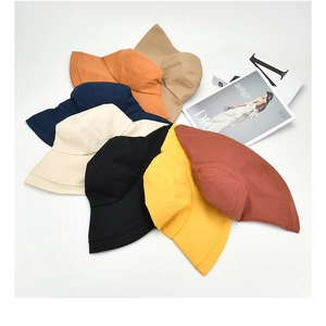 Detailed top view of wide brim sun hats in various colors with cotton canvas texture