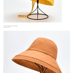 Detail of wide brim bucket hats in ginger and caramel with reinforced stitching