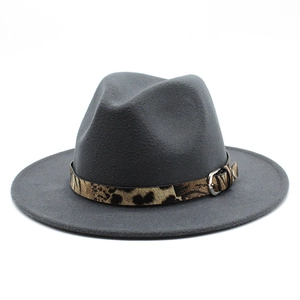 Detail of dark grey wool fedora hat featuring leopard print band and silver metal buckle