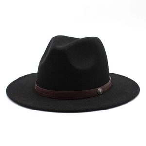 Detail of the black wool fedora featuring a brown leather band and antique metal buckle