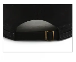Detail of adjustable metal buckle and black twill fabric strap on the military cap back