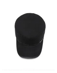 Top view of a black flat top military cap showing vintage canvas texture and metal buckles
