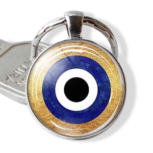 Blue Evil Eye keychain pendant with gold textured background and metal key ring