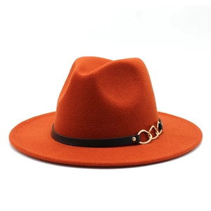 Detail of the orange wool fedora with a black leather band and gold chain decoration