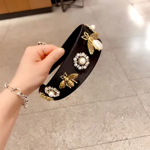 Retro black wide headband with golden bees, pearls, and crystals in vintage style