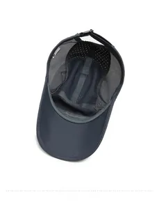 Detail of navy quick-dry baseball cap featuring breathable mesh and laser-cut vents
