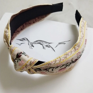 Floral embroidered wide headband with center knot in beige cotton linen fabric