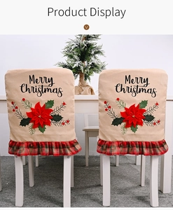 Detail of Christmas chair covers with Merry Christmas text and red poinsettia flowers
