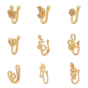 Nine gold non-piercing copper nose clips with star, heart and crown zircon designs