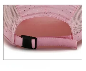 Close-up of pink quick-dry sports cap showing adjustable strap and breathable mesh