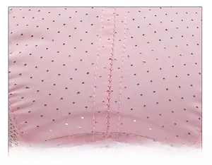 Macro shot of durable double-stitched seams on a pink breathable kids baseball cap