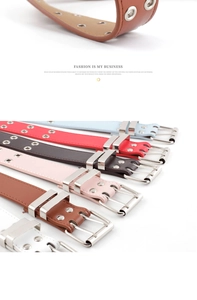 Detail of multi-color punk belts featuring double metal eyelets and silver square buckles