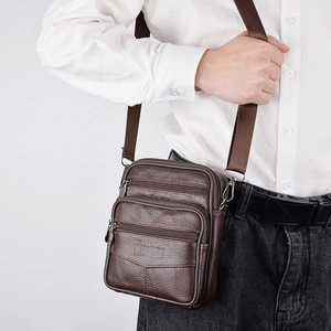 Men's dark brown textured leather crossbody waist bag with adjustable shoulder strap