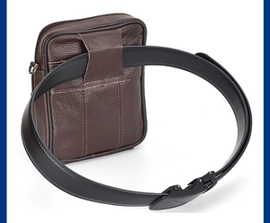 Close-up of brown lychee grain leather waist bag with functional belt loop and metal buckle