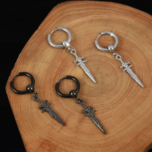 Silver and black punk sword dangle hoop earrings displayed on a rustic wooden tray