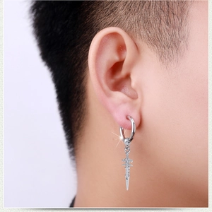 Retro punk silver sword drop earring for men and women shown on a model's ear