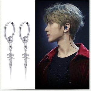 Detail view and model wearing silver sword drop hoop earrings in retro punk style