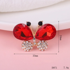 Macro shot of red butterfly rhinestone accessory with size 33mm and 24mm dimensions