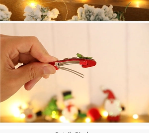 Detail view of red Christmas hair clip with green fabric wrap on festive background