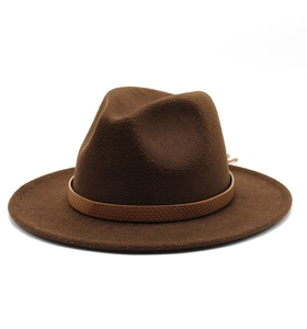 Detail of brown wool fedora hat featuring a snakeskin pattern leather decorative band