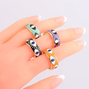 Hip hop style gold-plated evil eye enamel rings in multiple colors shown on hand