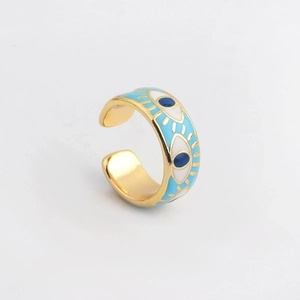 Detailed close-up of golden evil eye ring featuring blue and white enamel inlay work