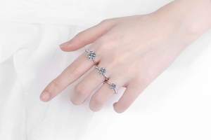 Three classic six-prong S925 sterling silver moissanite rings in varying carat sizes