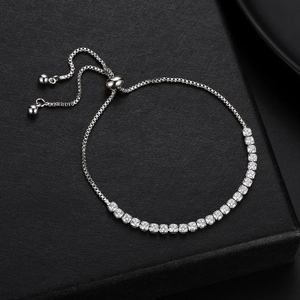 Detail of adjustable silver claw chain bracelet with sparkling round clear zircons