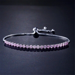 Detailed view of adjustable purple zircon tennis bracelet with silver-tone slider clasp