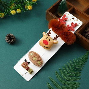 Detail of Christmas kids hair accessory set with plush reindeer clips and starry embroidery
