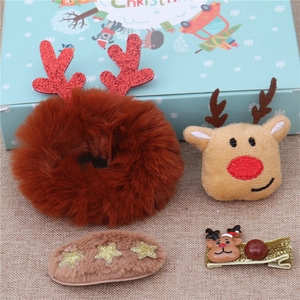 Close-up of 4-piece Christmas reindeer hair clip set with plush and sequin details