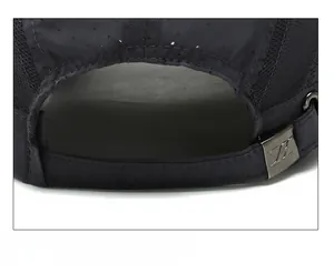 Close-up of adjustable metal buckle and breathable mesh fabric on sport baseball cap